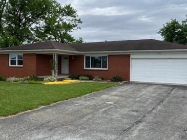 Charming brick ranch home with an attached garage and well-maintained front yard at 5457 W 900 North, McCordsville, IN 46055