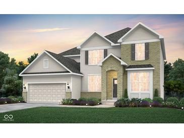 Charming two-story home with beige siding, a brick facade, and a manicured lawn at 7239 Barrett Dr, Brownsburg, IN 46112