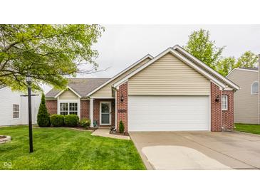 Lovely one-story home with attached two-car garage and well-maintained lawn at 12328 Slate Dr, Fishers, IN 46037