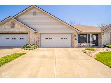 Charming brick home with a two-car garage, neat landscaping, and inviting front entrance at 188 Bay Ridge Dr, Pendleton, IN 46064
