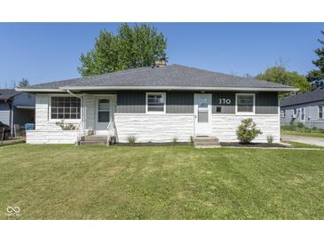 Charming single-story home with a well-maintained lawn and stone accents at 370 N Bazil Ave, Indianapolis, IN 46219
