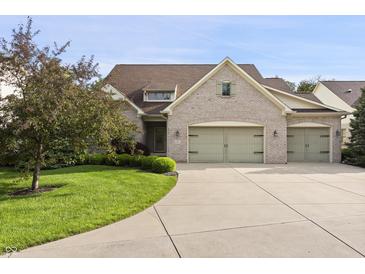 Charming home with a three-car garage, well-manicured lawn, and appealing landscaping at 4139 Bayberry Ct, Greenwood, IN 46143