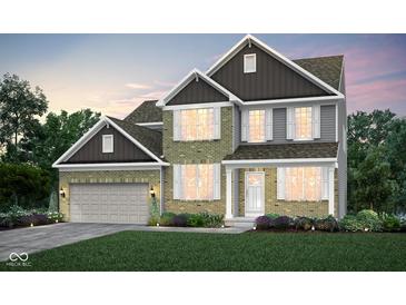 Charming two-story home featuring a brick and siding facade and an attached two-car garage at 7242 Barrett Dr, Brownsburg, IN 46112