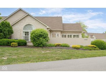 Charming brick home featuring a well-maintained yard and inviting curb appeal at 11438 Winding Wood Dr, Indianapolis, IN 46235