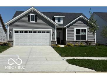 Charming single-Gathering home with gray siding, a two-car garage, and well-manicured front lawn at 19725 Highclere Lane, Sheridan, IN 46069