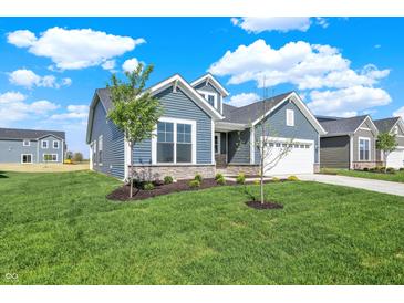 Charming single-Gathering home with blue siding, stone accents, manicured lawn, and inviting curb appeal at 19762 Highclere Lane, Sheridan, IN 46069