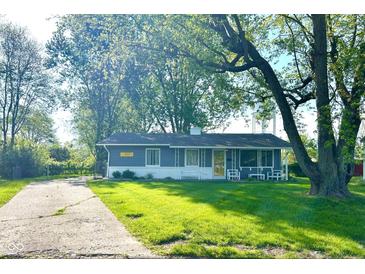 Charming home featuring a lush front lawn, mature trees, and inviting curb appeal at 503 Elmhurst Pl, Whiteland, IN 46184