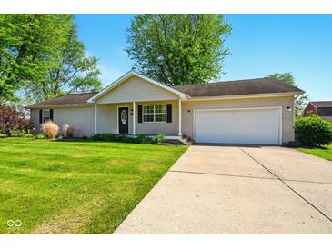 Charming ranch-style home with attached garage and well-maintained lawn, perfect for suburban living at 813 Stoner Dr, Anderson, IN 46013