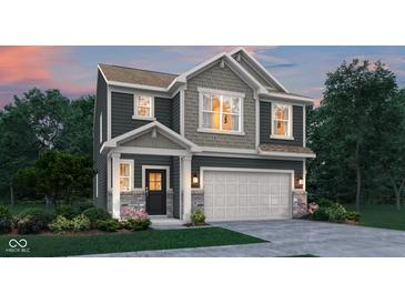 Charming two-story home with a mix of gray siding, stone accents, and well-manicured landscaping at 15338 Farrington Way, Fishers, IN 46037