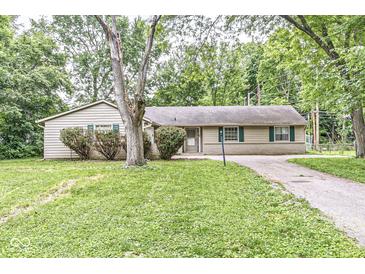 Ranch style home with mature trees and landscaping at 7503 Grandview Dr, Indianapolis, IN 46260