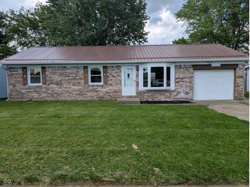 Charming brick home features a red roof, bay window, well-kept lawn, and an attached one car garage at 1280 Maple Ct, Martinsville, IN 46151
