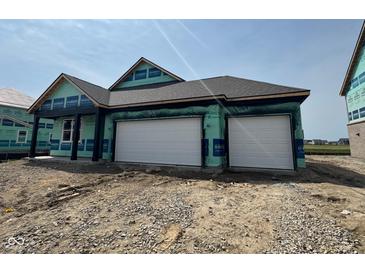 New construction home featuring a two-car garage, black trim, and architectural roofing at 1351 Foxtail Ln, Greenwood, IN 46143
