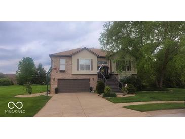 Beautiful two-story home with a well-manicured lawn and inviting front porch at 1714 Michelle Mnr, Danville, IN 46122