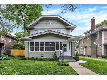 Charming two-story home featuring a cozy screened-in porch and well-maintained landscaping at 3918 N Park Ave, Indianapolis, IN 46205
