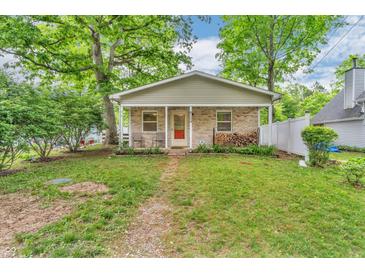 Quaint single-story home with a covered porch, brick accents, and a well-maintained yard at 4154 W Briarwood Lake S Dr, Monrovia, IN 46157