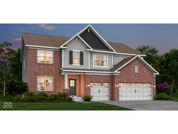 Charming two-story brick home with a two-car garage and well-manicured lawn offers great curb appeal at 4159 Persian St, Greenwood, IN 46143