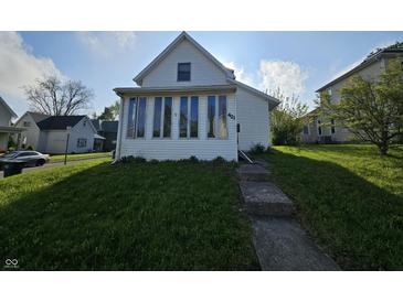 Charming home featuring a quaint front yard and multiple windows at 421 N Canal St, Alexandria, IN 46001