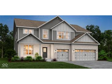 Charming two-story home with a light brick facade, gray siding, and a well-manicured lawn at 4355 Persian St, Greenwood, IN 46143