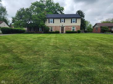 Beautiful two-story home with a brick and siding exterior and expansive green lawn at 5433 Brendonridge Rd, Indianapolis, IN 46226