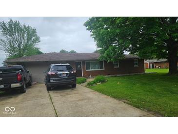 Charming single-story brick home with a well-maintained front yard and a two-car attached garage at 5805 S Gale St, Indianapolis, IN 46227