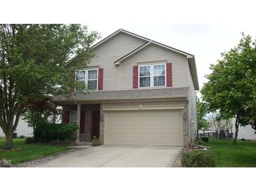 Charming two-story home featuring a two-car garage, neutral siding, and complementary red shutters at 8160 Whitham Dr, Indianapolis, IN 46237
