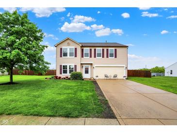 Charming two-story home features a well-manicured lawn, a two-car garage, and lovely curb appeal at 714 Thornburg Pkwy, Brownsburg, IN 46112