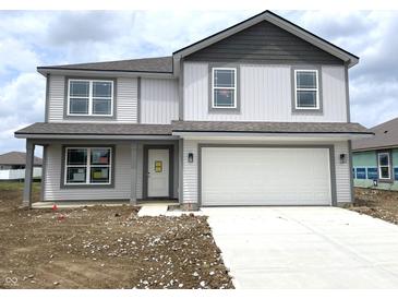 Charming two-story home with gray and white accents and a two-car garage at 1204 Mcbride St, Greenfield, IN 46140
