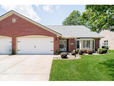 Charming brick home featuring an attached garage and beautifully maintained front lawn at 194 Waterford Ct, Avon, IN 46123