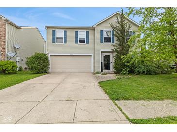 Charming two-story home with a well-maintained lawn, two-car garage and beautiful blue shutters at 2249 Blossom Dr, Greenwood, IN 46143
