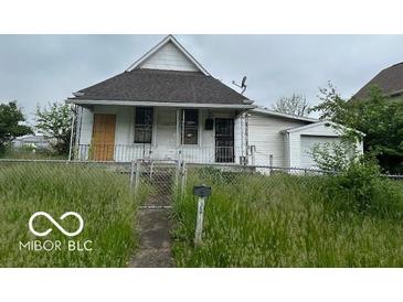 An exterior view of a home with lawn and attached garage at 226 Miley Ave, Indianapolis, IN 46222