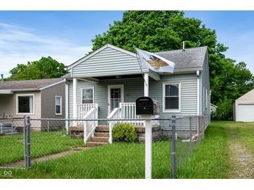 Charming exterior view of a cozy one-story home with a well-maintained lawn and an inviting entrance at 732 S Biltmore Ave, Indianapolis, IN 46241