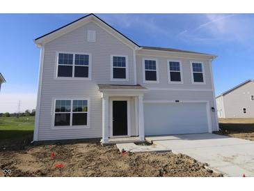 Charming two-story home features a two-car garage and a classic light gray exterior at 7329 Waylon Way, Indianapolis, IN 46239
