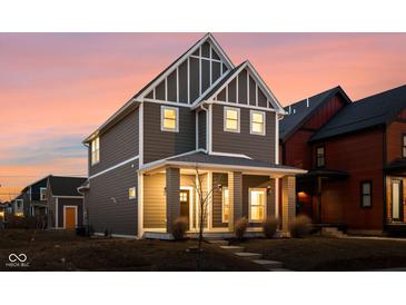 Beautiful two-story home with a charming front porch and modern design elements at 2024 Yandes St, Indianapolis, IN 46202