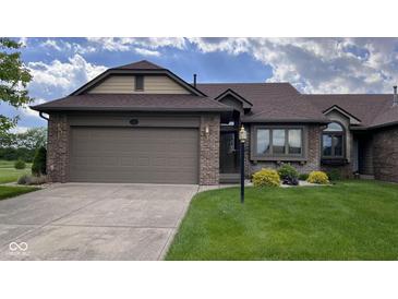 Charming single-story home with attached garage, brick accents, and well-maintained lawn at 326 Kilpatrick Ct, Edinburgh, IN 46124