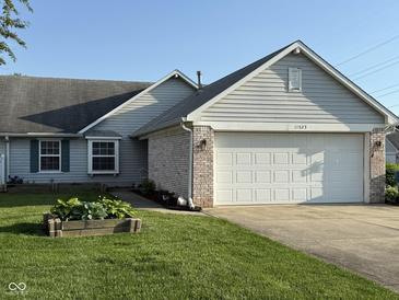 Charming single Gathering home with attached two car garage, and landscaped yard at 11523 Coastal Way, Indianapolis, IN 46229