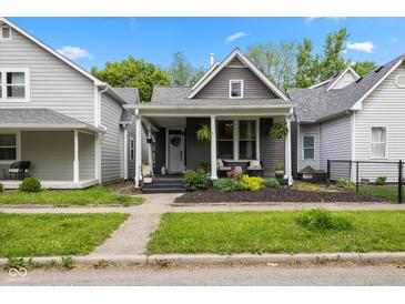 Charming single-Gathering home with a welcoming front porch and well-maintained landscaping at 1730 Hoyt Ave, Indianapolis, IN 46203