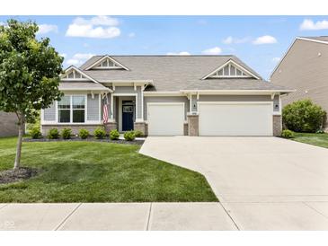 Charming single-story home with a well-manicured lawn, a two-car garage, and a welcoming entrance at 4428 Maldenhair Dr, Indianapolis, IN 46239