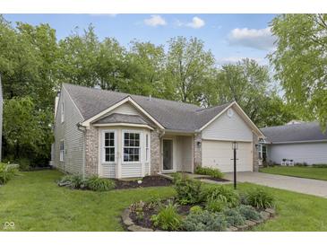 Charming single-Gathering home with well-maintained lawn and attached garage in a quiet neighborhood setting at 5988 White Birch Dr, Fishers, IN 46038