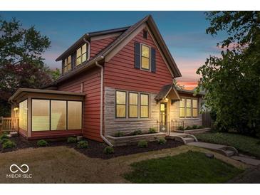 Charming two-story home with a well-maintained lawn and stone accents for added curb appeal at 1497 Clinton St, Noblesville, IN 46060