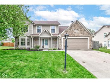 Charming two-story home featuring a well-maintained lawn and inviting front porch at 18915 Fairfield Blvd, Noblesville, IN 46060