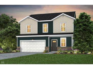 Charming two-story home with a dark-green exterior, white trim, a two-car garage, and beautiful landscaping at 5931 Sterling Dr, Whitestown, IN 46075
