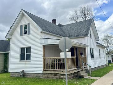 Charming two-story home with a welcoming front porch and manicured lawn at 600 S Oak St, Fortville, IN 46040