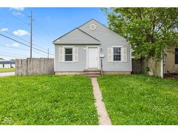 Charming single-story home with gray siding, white trim, and a well-maintained lawn at 703 Kappes St, Indianapolis, IN 46221