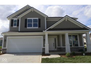 Charming two-story home with a large two-car garage and craftsman-style details at 16835 Cheddar Dr, Noblesville, IN 46060