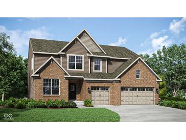 Beautiful two-story home with brick and siding exterior, showcasing a two-car garage and well-maintained lawn at 5312 Summerton St, McCordsville, IN 46055