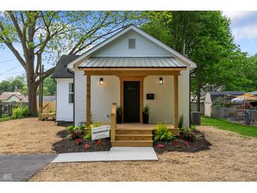 Charming renovated home featuring a cozy porch and well-manicured landscaping at 650 Overstreet St, Franklin, IN 46131