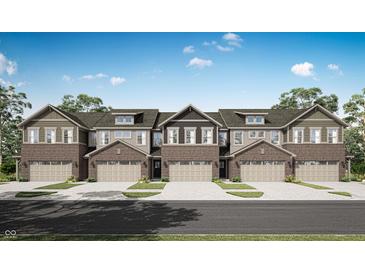 A welcoming townhome showcasing a brick facade, complemented by neutral siding and individual garages at 6683 Halsey St, Zionsville, IN 46077