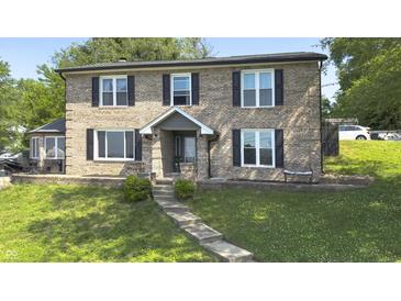 Charming two-story brick home with black shutters and a welcoming front entrance at 80 E College Ave, Martinsville, IN 46151