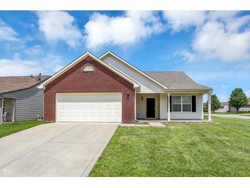 Charming single-Gathering home with brick facade, attached garage, and well-maintained lawn at 3222 Enclave Ln, Greenwood, IN 46143