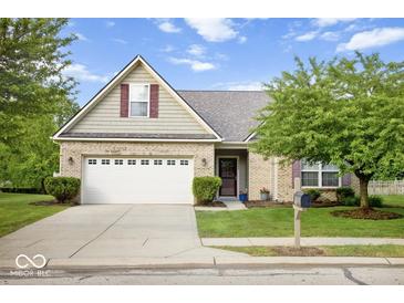 Charming single-Gathering home with well-maintained lawn, mature trees, and a two-car garage at 7242 Blue Ridge Dr, Noblesville, IN 46062